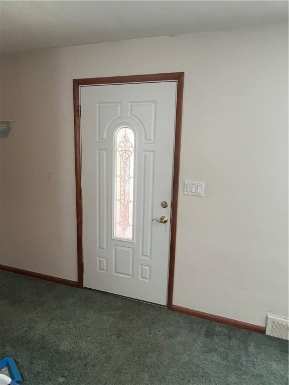 view of carpeted foyer