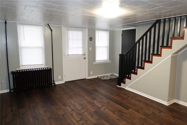 entryway featuring radiator and dark hardwood / wood-style flooring