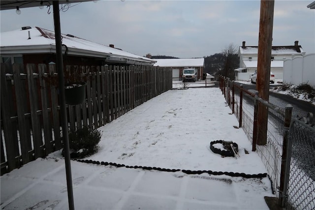 view of yard layered in snow