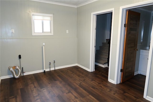 washroom with crown molding and dark wood-type flooring