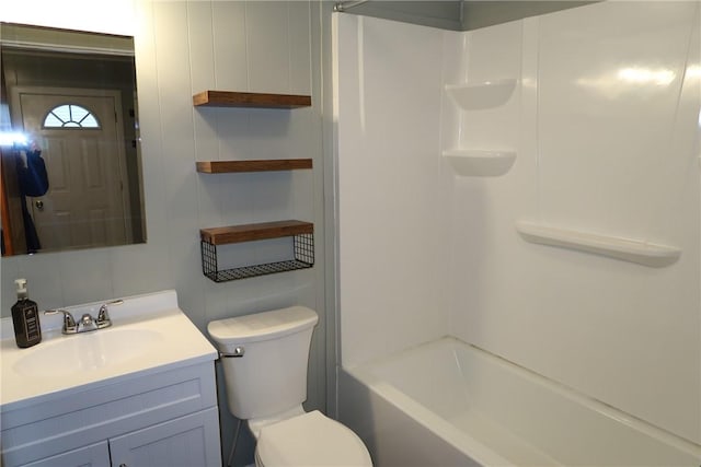 full bathroom featuring vanity, shower / bathtub combination, and toilet