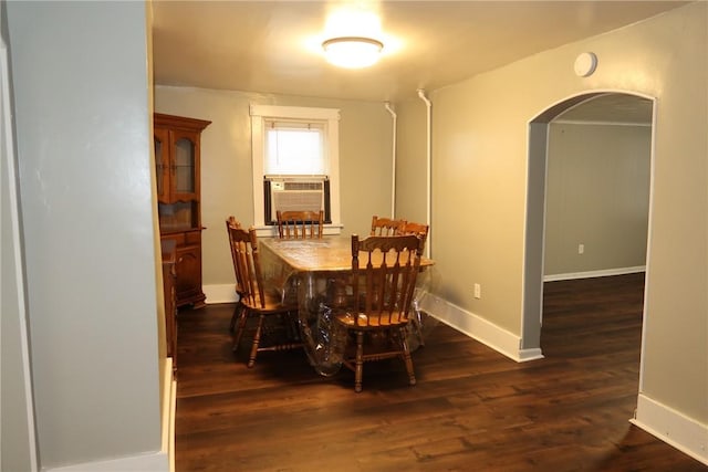 dining area with dark hardwood / wood-style floors and cooling unit