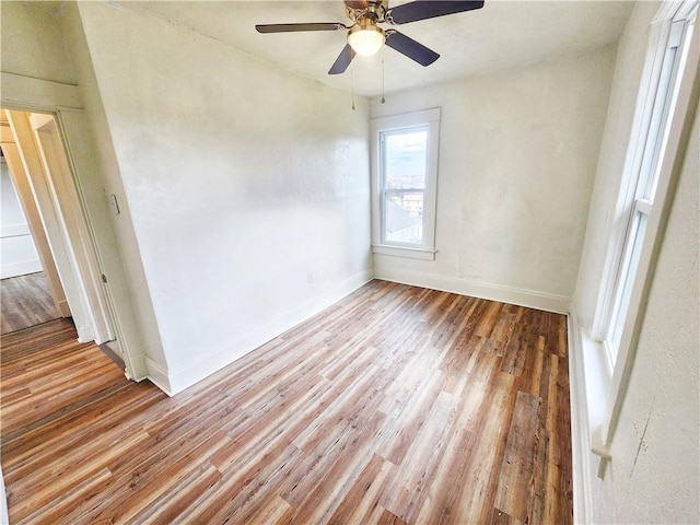 spare room with ceiling fan and light hardwood / wood-style floors