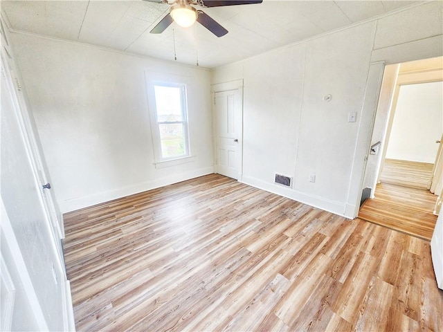 unfurnished room featuring ceiling fan and light hardwood / wood-style flooring