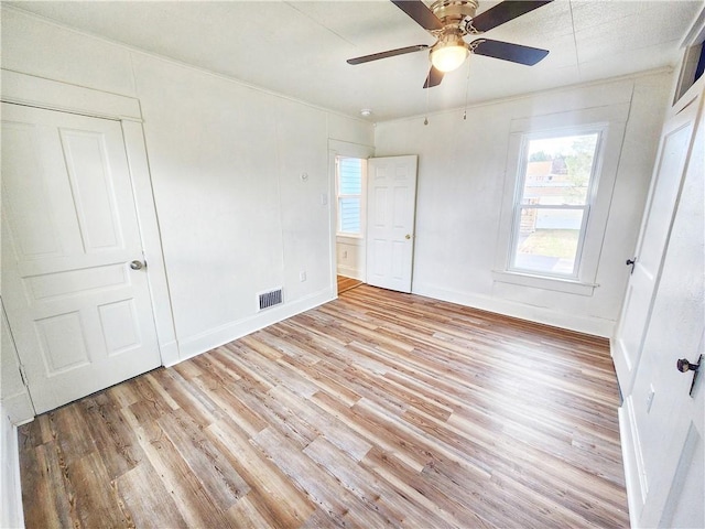 unfurnished bedroom featuring ceiling fan and light hardwood / wood-style flooring