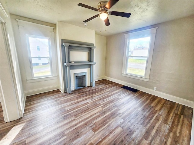 2013 S Jefferson St, Shenango Twp Law, PA 16102 - unfurnished living room with a fireplace, wood finished floors, and baseboards