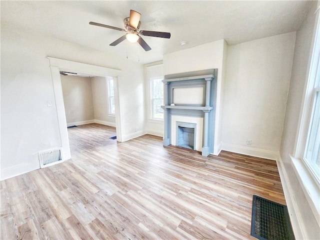 2013 S Jefferson St, Shenango Twp Law, PA 16102 - unfurnished living room with wood finished floors, a ceiling fan, a fireplace, and baseboards