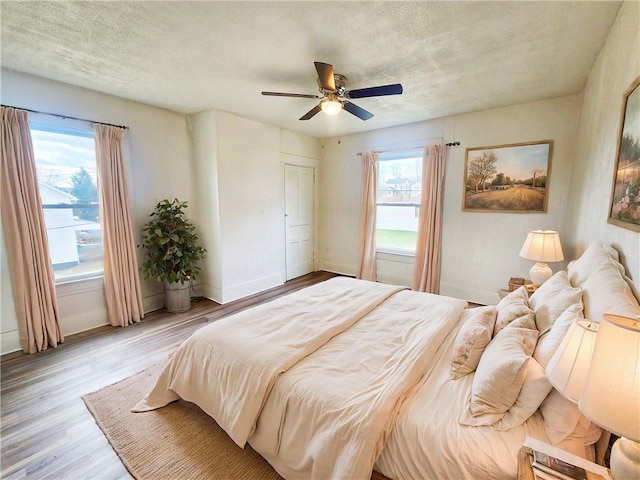 bedroom featuring a closet, ceiling fan, and light hardwood / wood-style flooring