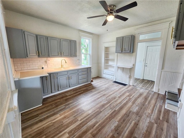 2013 S Jefferson St, Shenango Twp Law, PA 16102 - kitchen featuring gray cabinetry, a sink, dark wood-style floors, and a textured ceiling