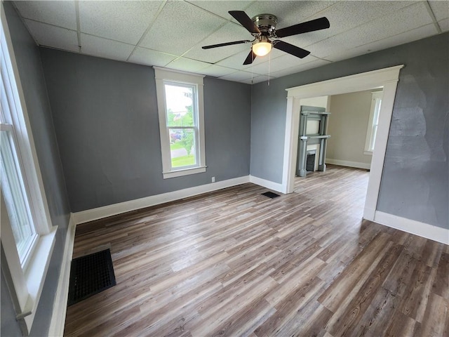 2013 S Jefferson St, Shenango Twp Law, PA 16102 - spare room with a drop ceiling, wood finished floors, a ceiling fan, and baseboards