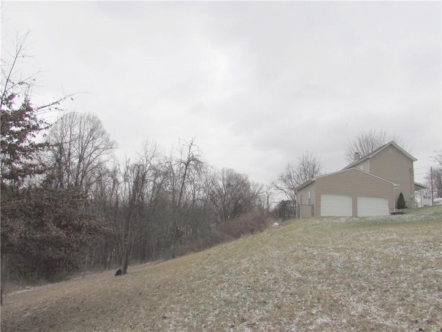 view of yard featuring a garage