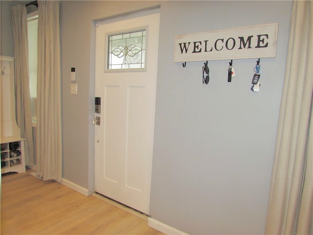 mudroom with light hardwood / wood-style floors