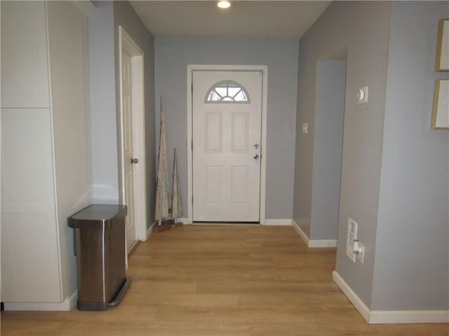 doorway to outside with light hardwood / wood-style floors