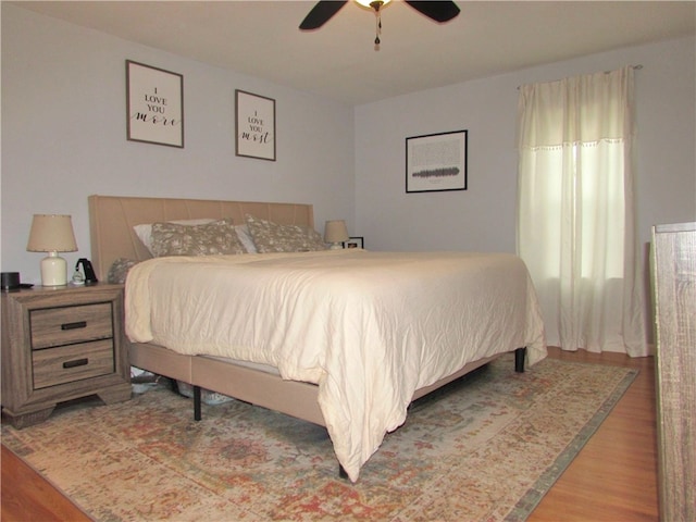 bedroom featuring wood-type flooring and ceiling fan