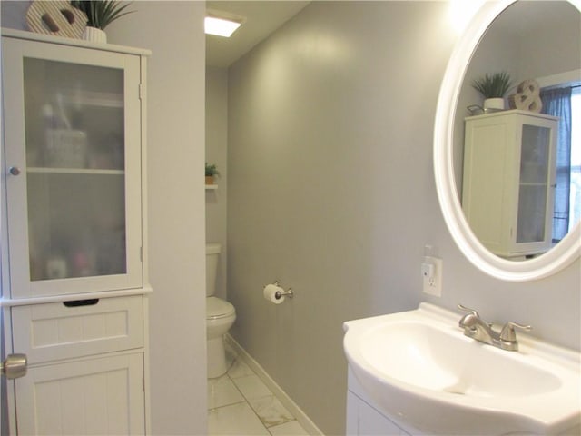 bathroom with toilet and sink