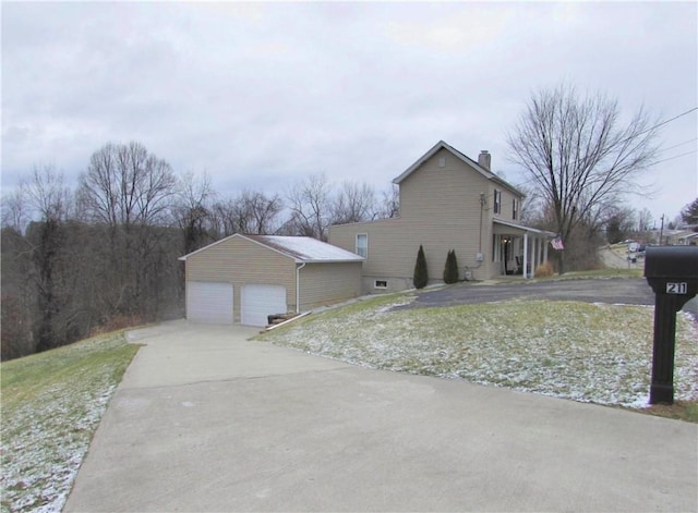 view of side of home featuring a garage