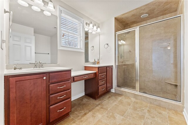 bathroom featuring vanity and a shower with door