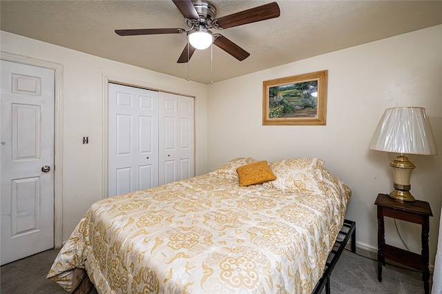 carpeted bedroom featuring ceiling fan and a closet