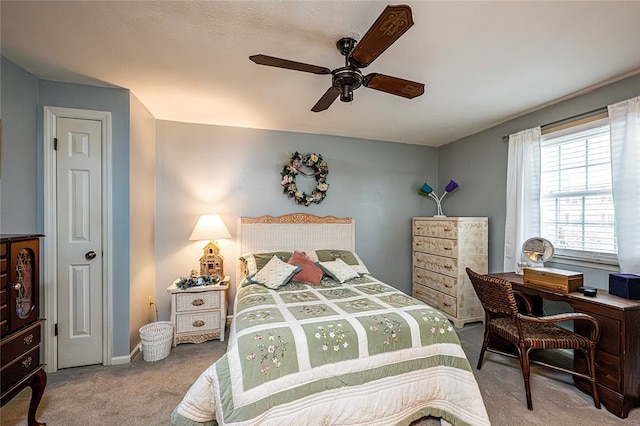 bedroom with ceiling fan and carpet