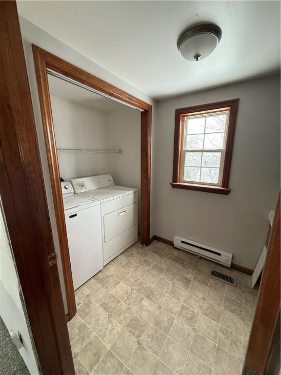 laundry room featuring separate washer and dryer and baseboard heating