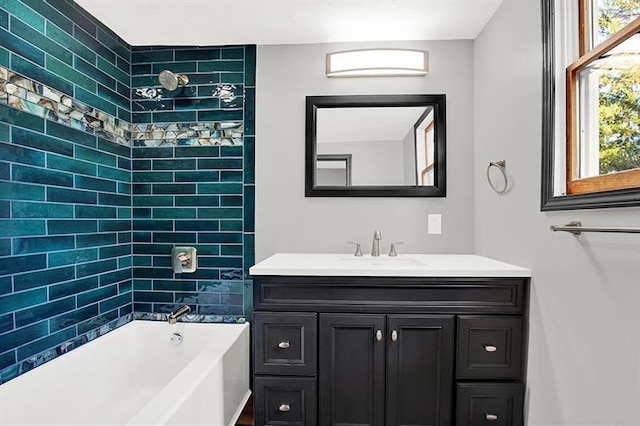 bathroom featuring vanity and tiled shower / bath combo