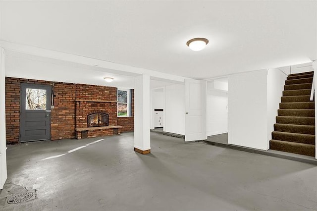 basement featuring a brick fireplace