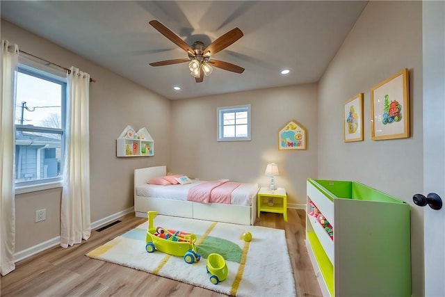 bedroom with hardwood / wood-style floors and ceiling fan