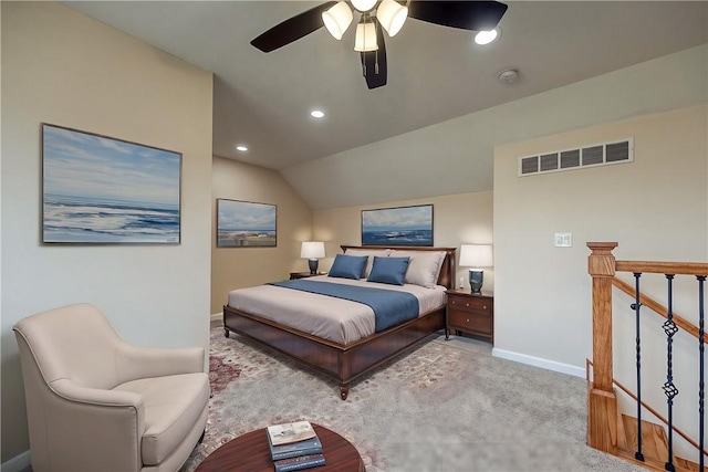 bedroom featuring ceiling fan, light colored carpet, and lofted ceiling