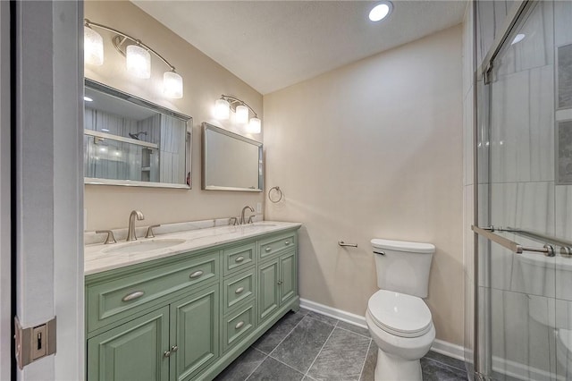 bathroom featuring vanity, toilet, and walk in shower