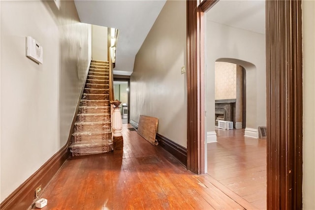 stairs featuring hardwood / wood-style flooring