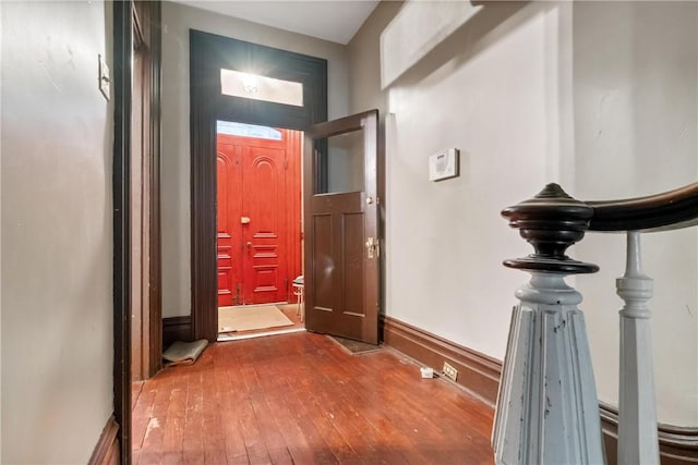 hall with hardwood / wood-style floors