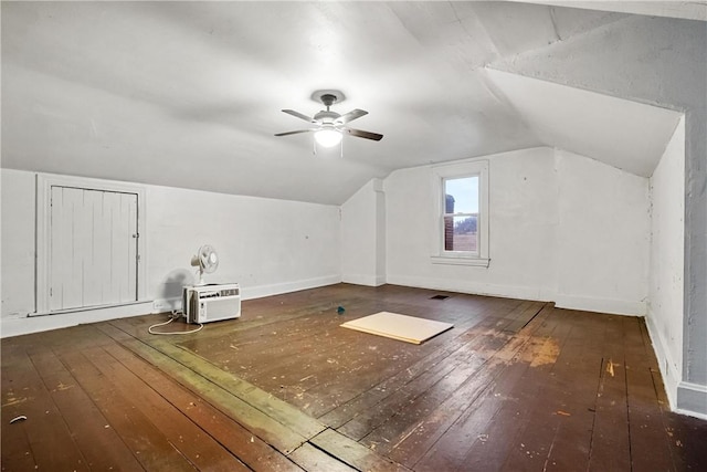 additional living space with vaulted ceiling, ceiling fan, and dark wood-type flooring