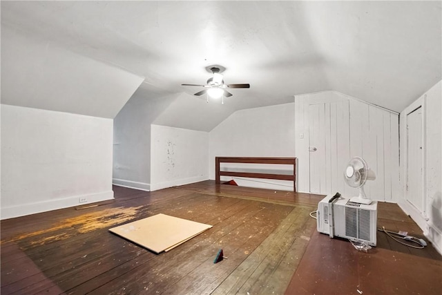 bonus room with ceiling fan, dark wood-type flooring, a wall mounted AC, and vaulted ceiling