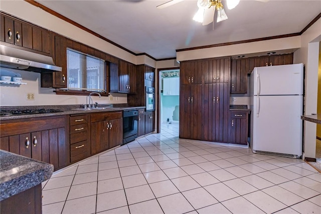 kitchen with appliances with stainless steel finishes, sink, dark brown cabinetry, and exhaust hood