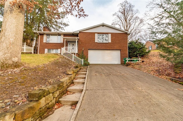 view of front of home featuring a porch and a garage