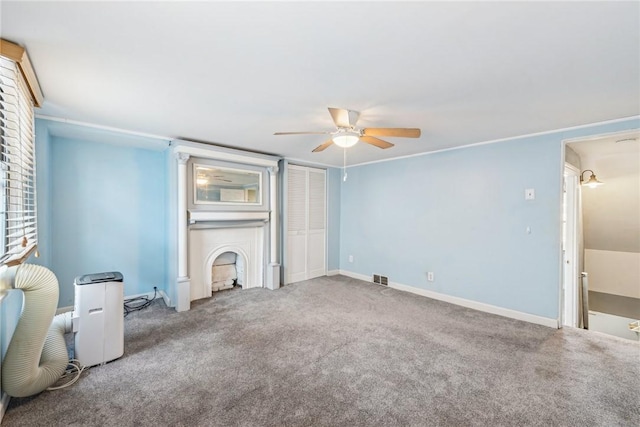 unfurnished living room with ceiling fan and carpet floors