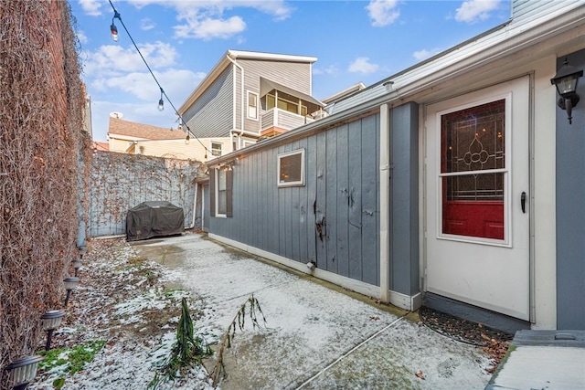 view of side of property featuring a patio area