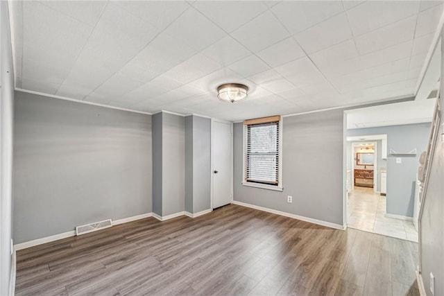 unfurnished bedroom featuring hardwood / wood-style flooring