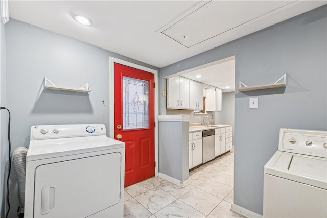 laundry room with washing machine and dryer and sink