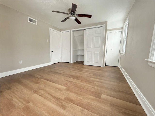 unfurnished bedroom featuring light hardwood / wood-style flooring and ceiling fan