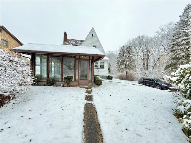 view of front of house with a sunroom