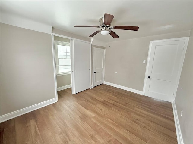 unfurnished bedroom with light hardwood / wood-style floors and ceiling fan