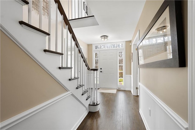 foyer entrance with dark wood-type flooring