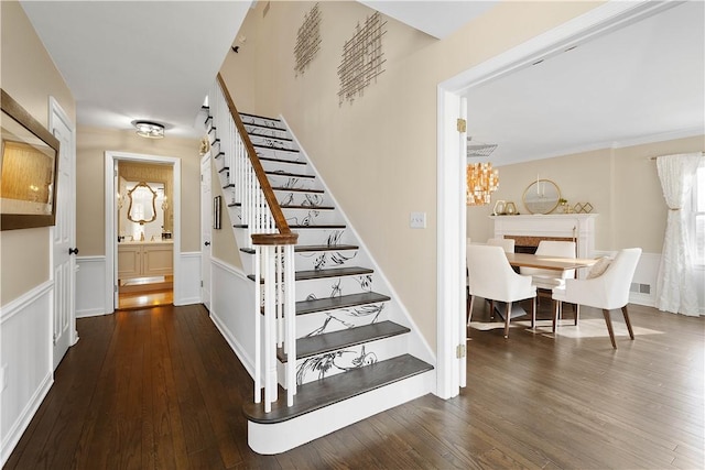 staircase featuring hardwood / wood-style floors