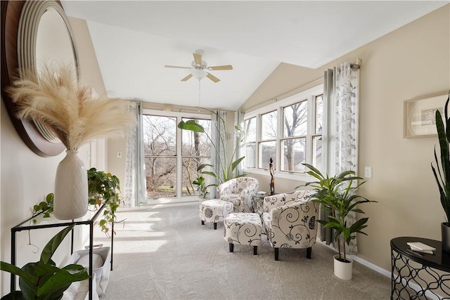 sunroom with ceiling fan and lofted ceiling