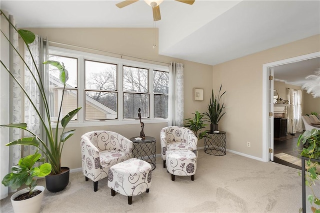 sitting room with ceiling fan and light colored carpet