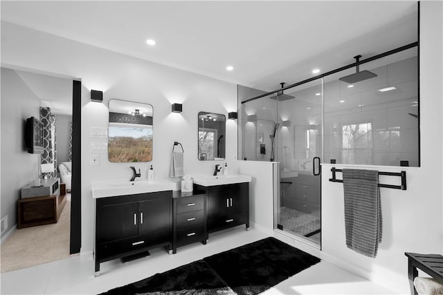 bathroom featuring vanity and a shower with shower door