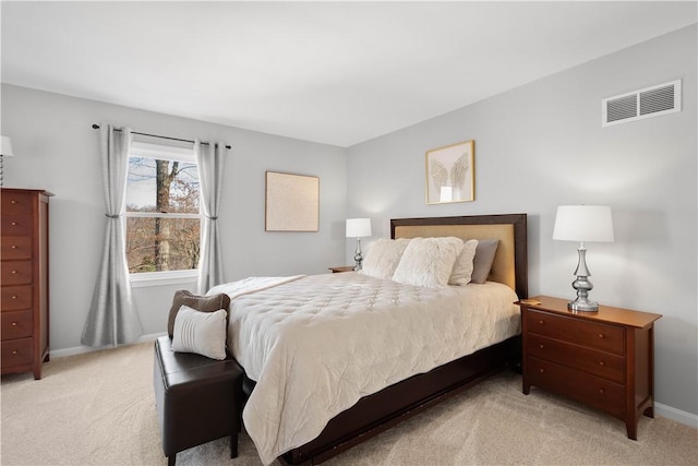 bedroom featuring light carpet