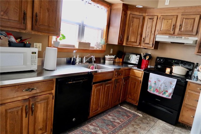 kitchen with brown cabinets, under cabinet range hood, a sink, and black appliances
