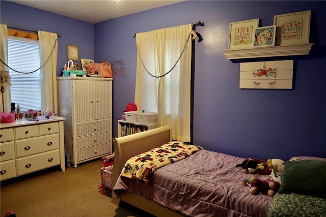 bedroom with light colored carpet